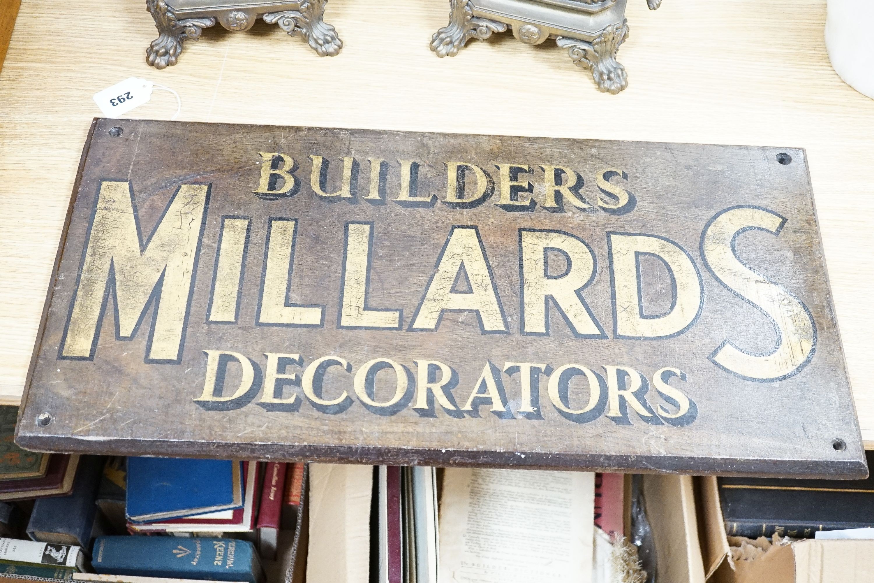 A painted wood advertising sign ‘MILLARDS BUILDERS DECORATORS’, pre war 33x67cm